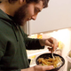 Image for article titled Man Figures He Has 2 More Bites Of Roommate’s Leftovers Before It Noticeable